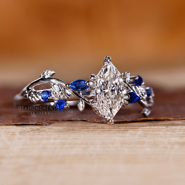 Dutch marquise ring with round cut tanzanite side stones.