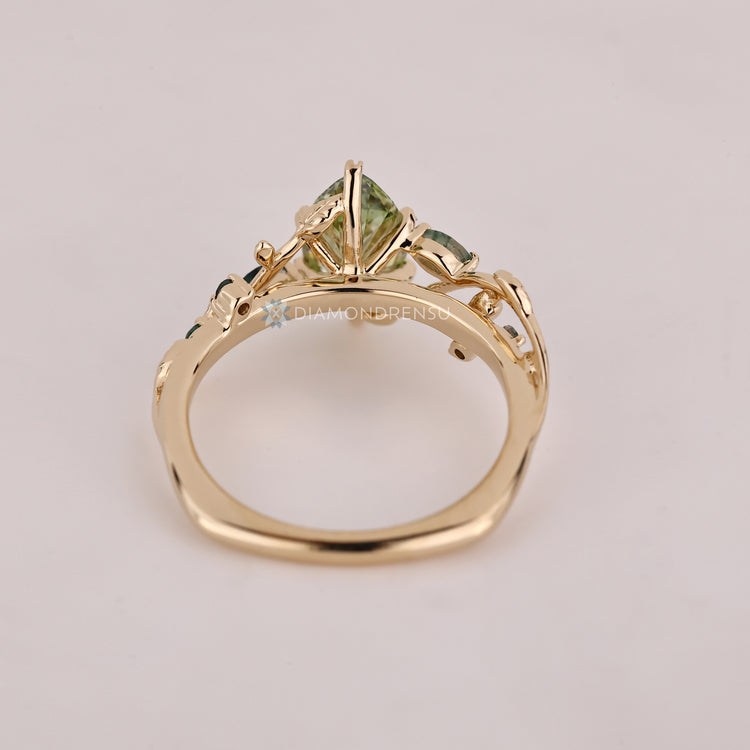 Handmade green centre diamond ring with Euro shank.