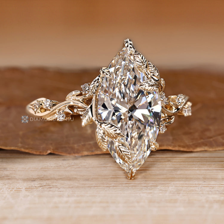 Lab grown diamond ring with six leaf style prongs.
