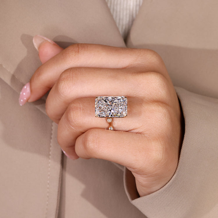 Radiant cut diamond ring with handcrafted nature inspired style.