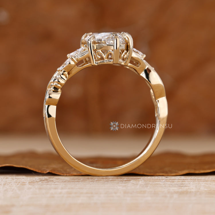 Marquise centre diamond with blooming flower bud setting.