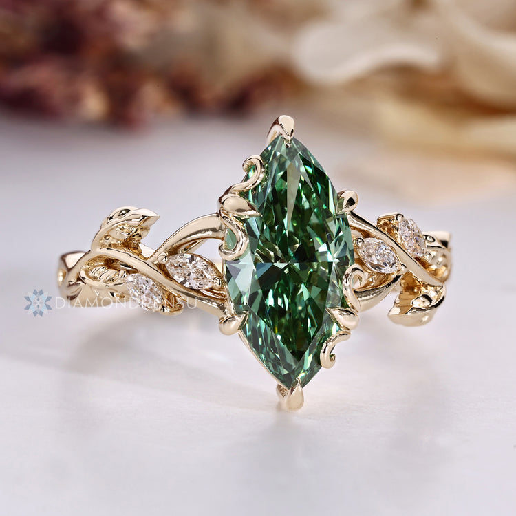 Art Deco diamond ring with green centre diamond.