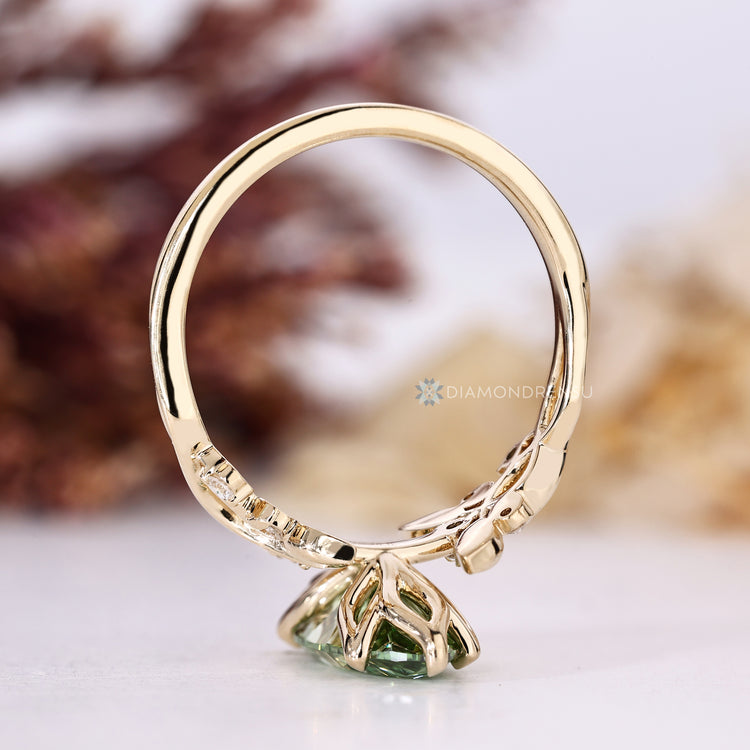 Handmade green diamond ring with six claw setting.