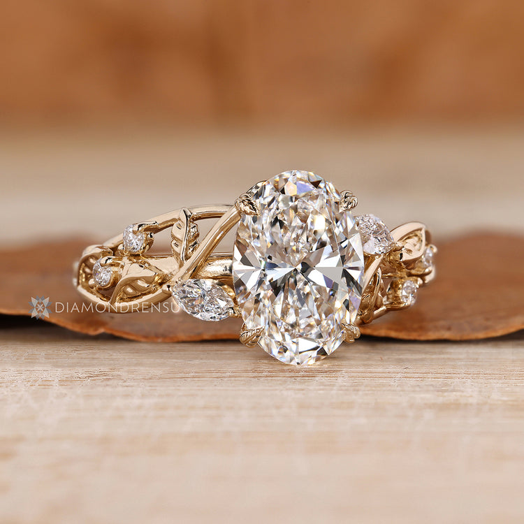 Lab grown diamond oval engagement ring with round side stones.