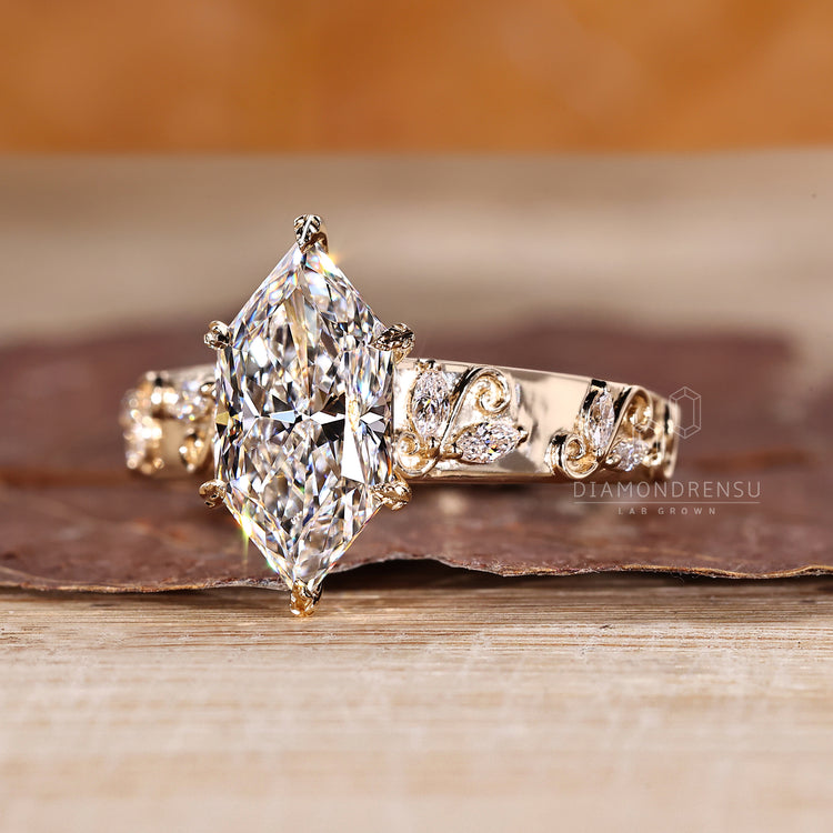 Marquise diamond ring with art deco design and tapered shank.