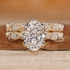 Diamond ring and wedding band with oval centre diamond.
