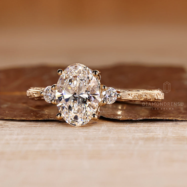 Oval lab diamond ring with vintage filigree shank design.
