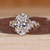 Oval cut lab grown diamond ring with cluster setting.