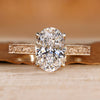 Oval cut diamond ring with art deco style.