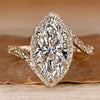 Pavé engagement ring with marquise cut diamond.