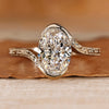 Oval cut diamond ring with bypass setting.