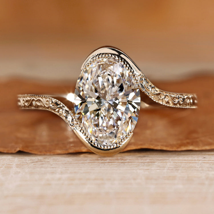 Oval cut diamond ring with bypass setting.