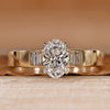 Oval cut diamond ring with baguette side stones.