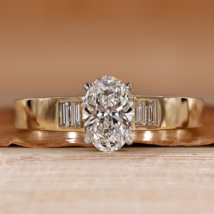 Oval cut diamond ring with baguette side stones.