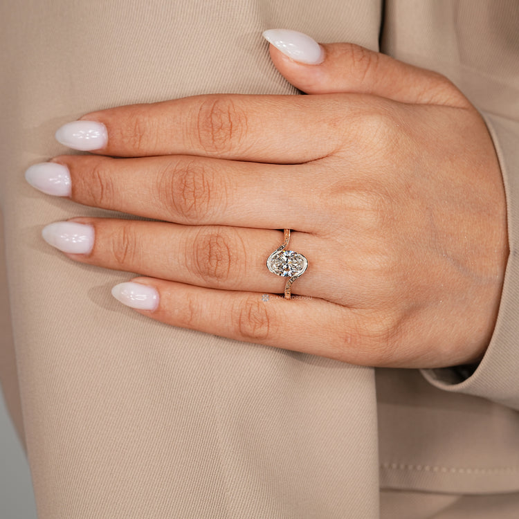 Art Deco oval diamond ring with bypass setting.