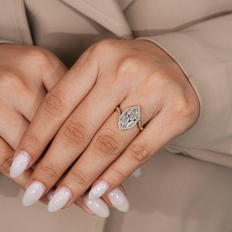 Marquise diamond ring with bypass setting design.