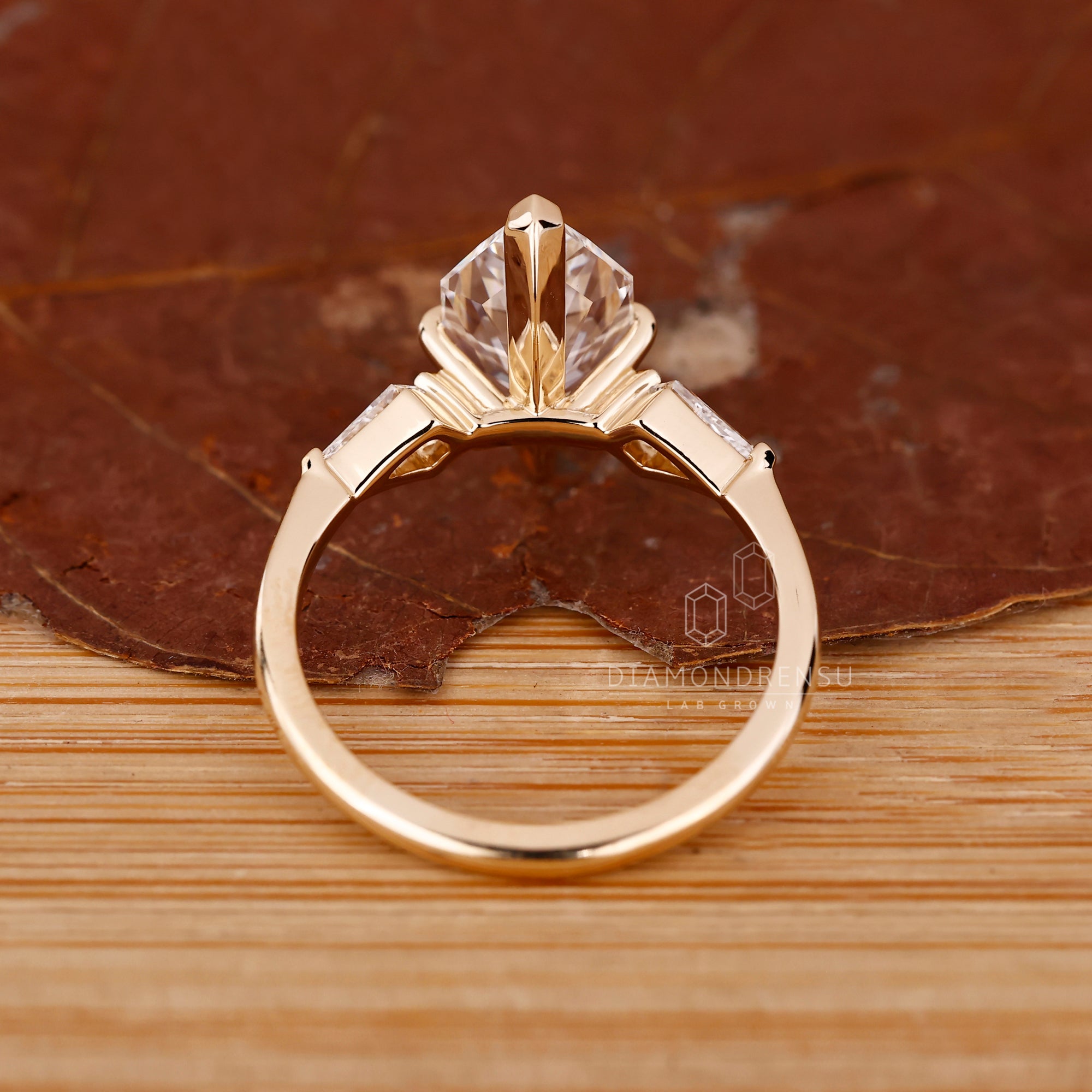 Lab Grown Diamond set in tapered yellow gold band.
