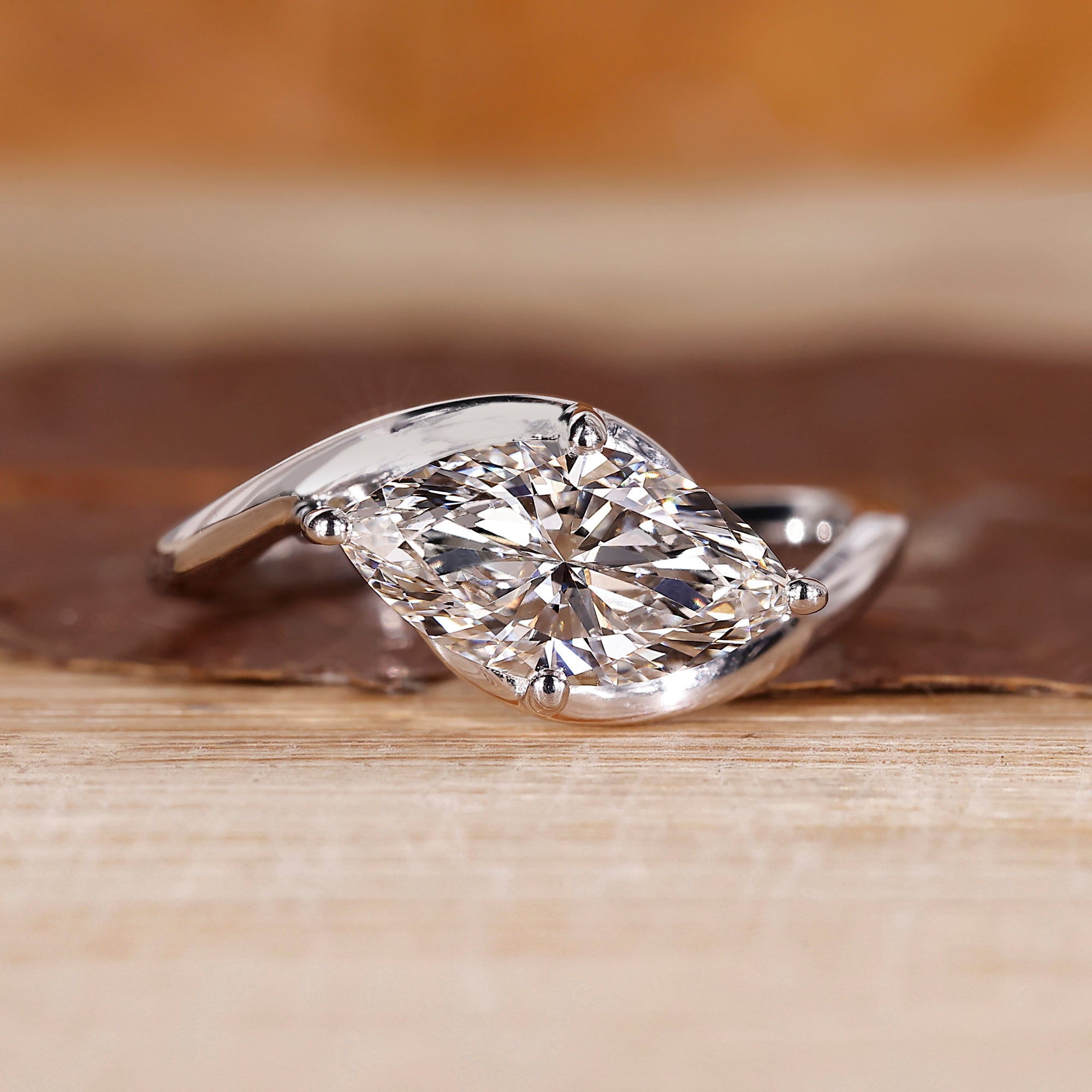 East to west setting ring with marquise diamond.
