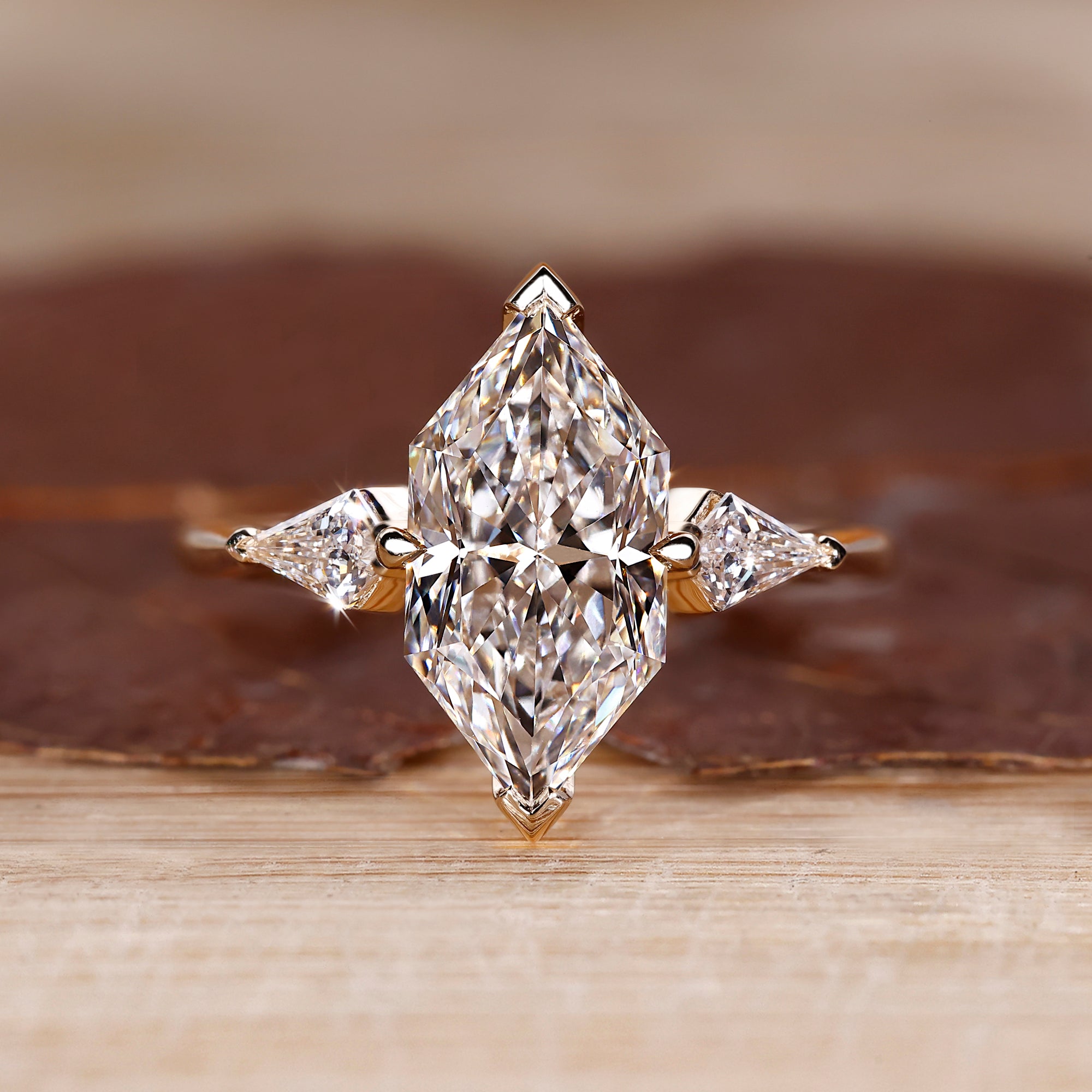 Three stone ring with Dutch Marquise center stone.
