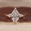 Three stone ring with Dutch Marquise center stone.
