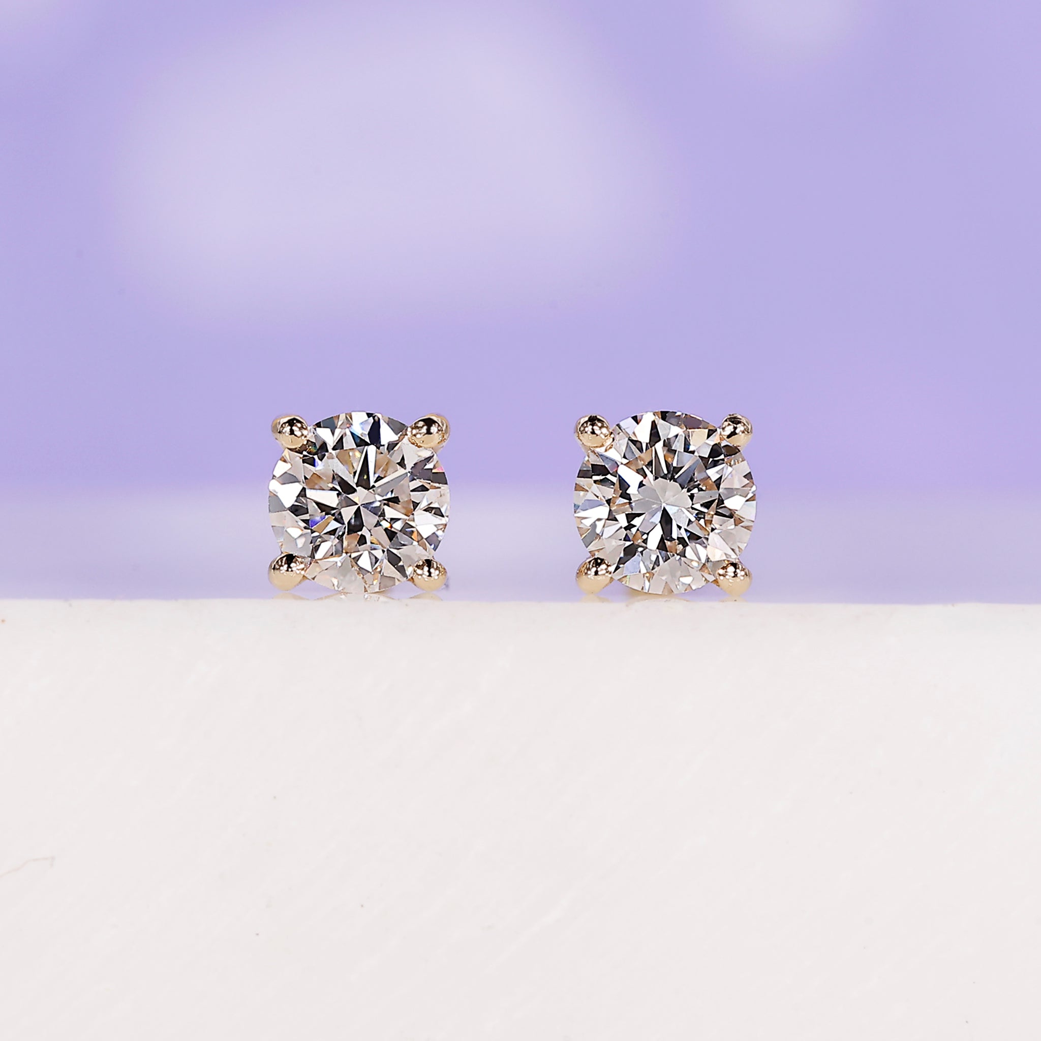 0.50 carat total diamond stud earrings.