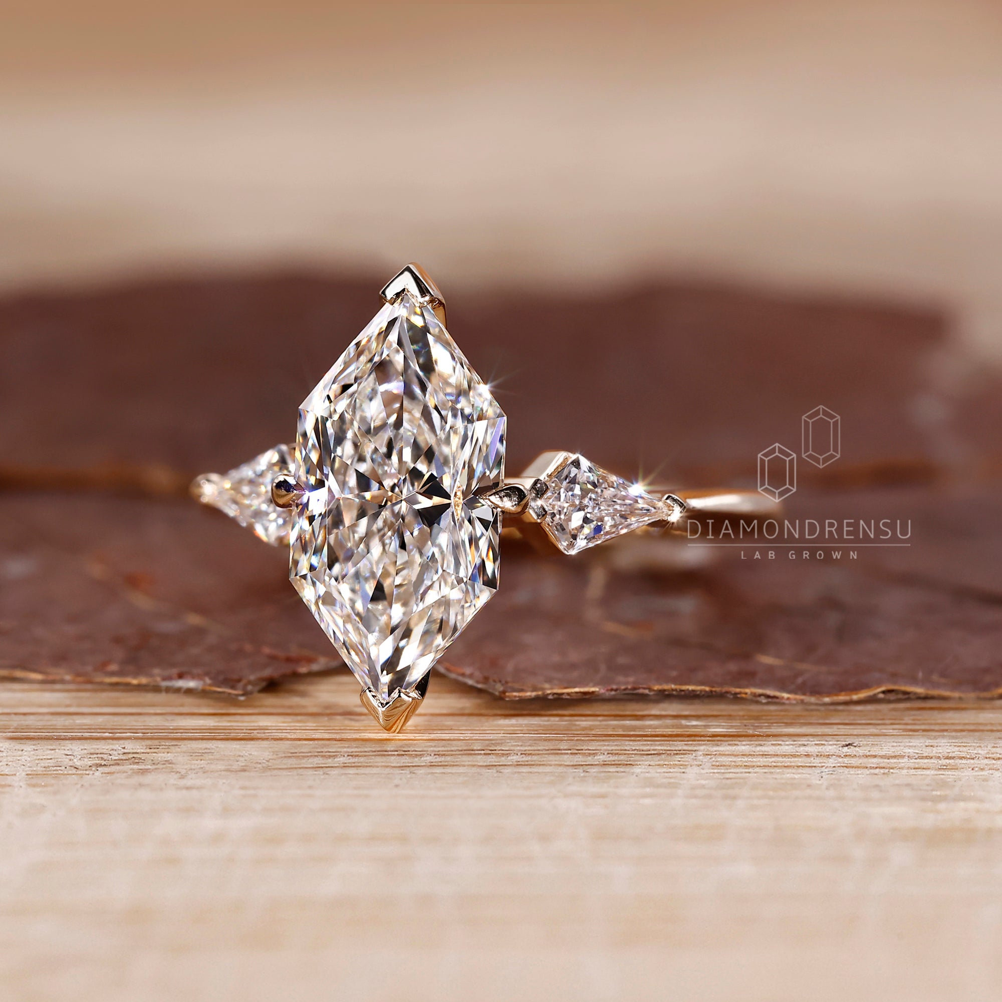 Tapered shank ring with Dutch Marquise centerpiece.
