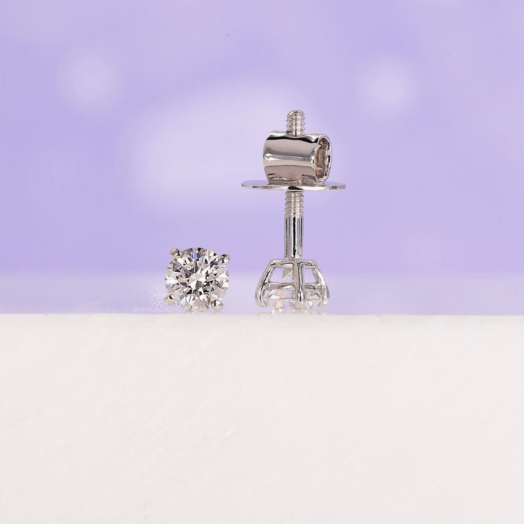 Screw back white gold diamond studs.