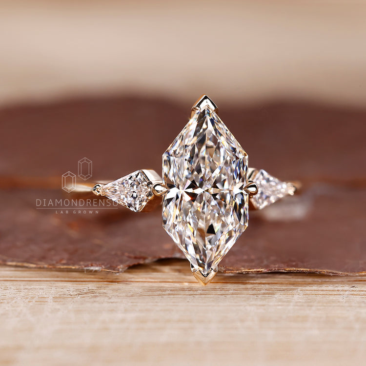 V shaped prong setting holds the center diamond.
