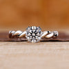 Round diamond engagement ring in white gold.
