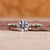 Knife Edge Ring with emerald round cut diamond center.
