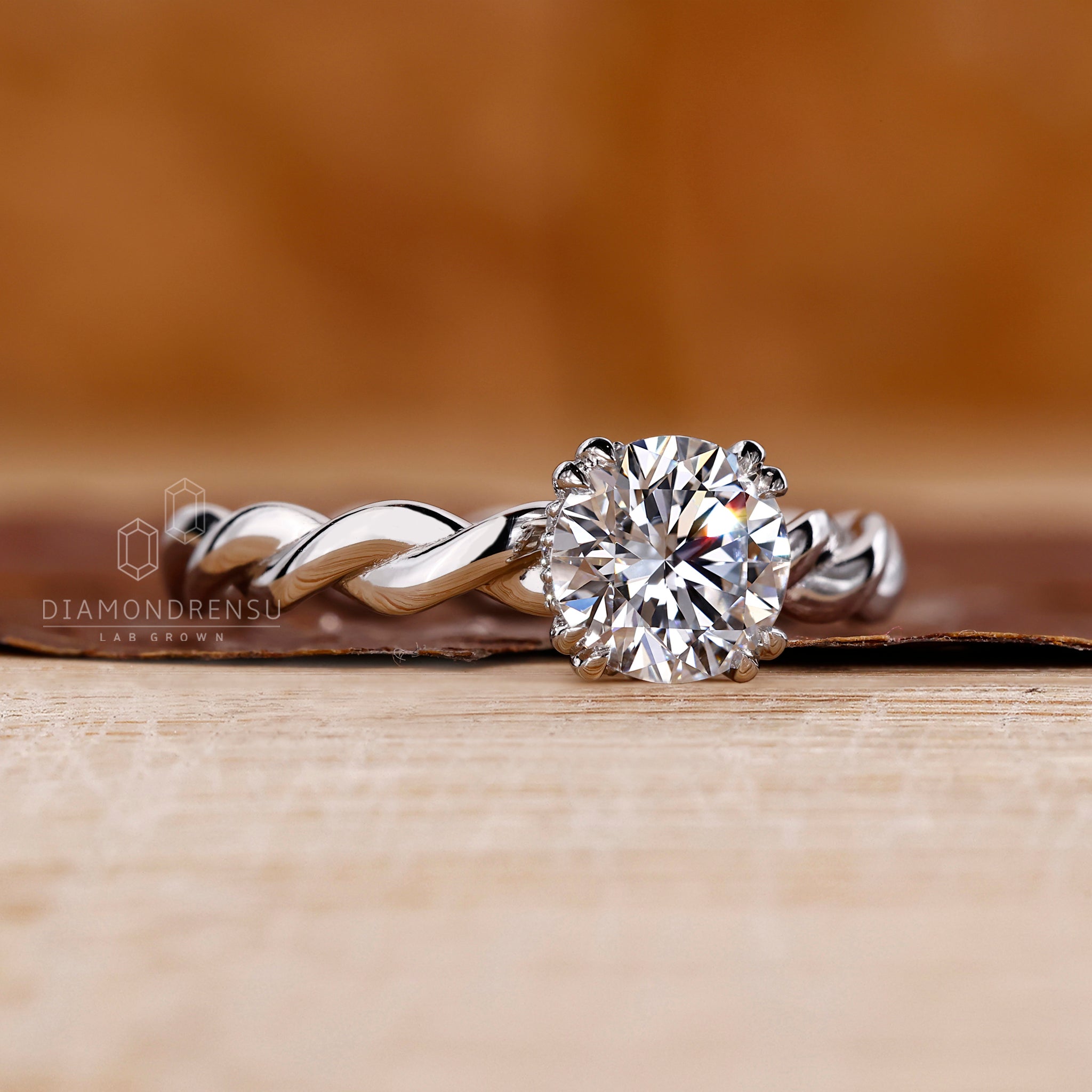 Twisted setting ring with double claw prong detail.
