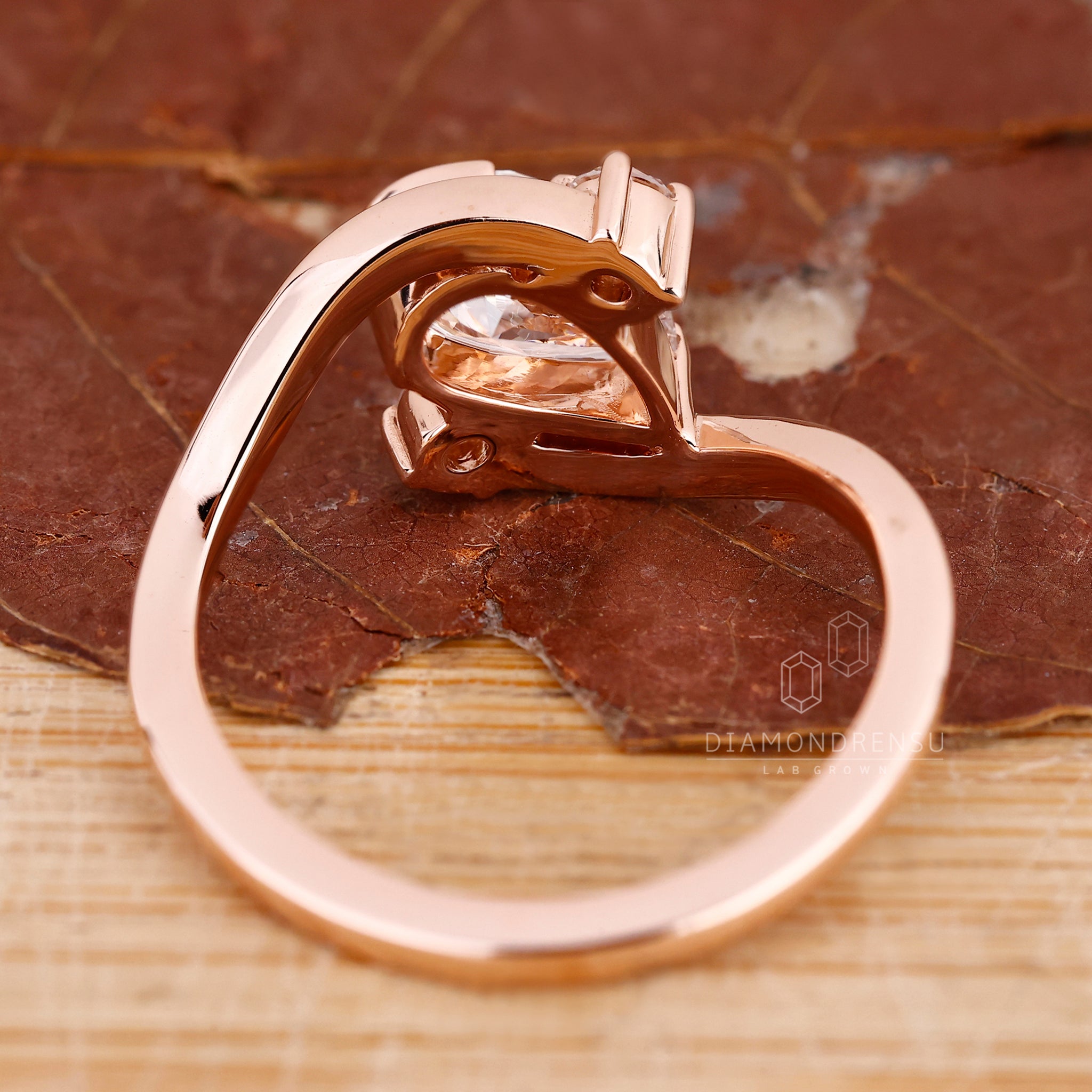 Custom engagement ring in a three stone layout.
