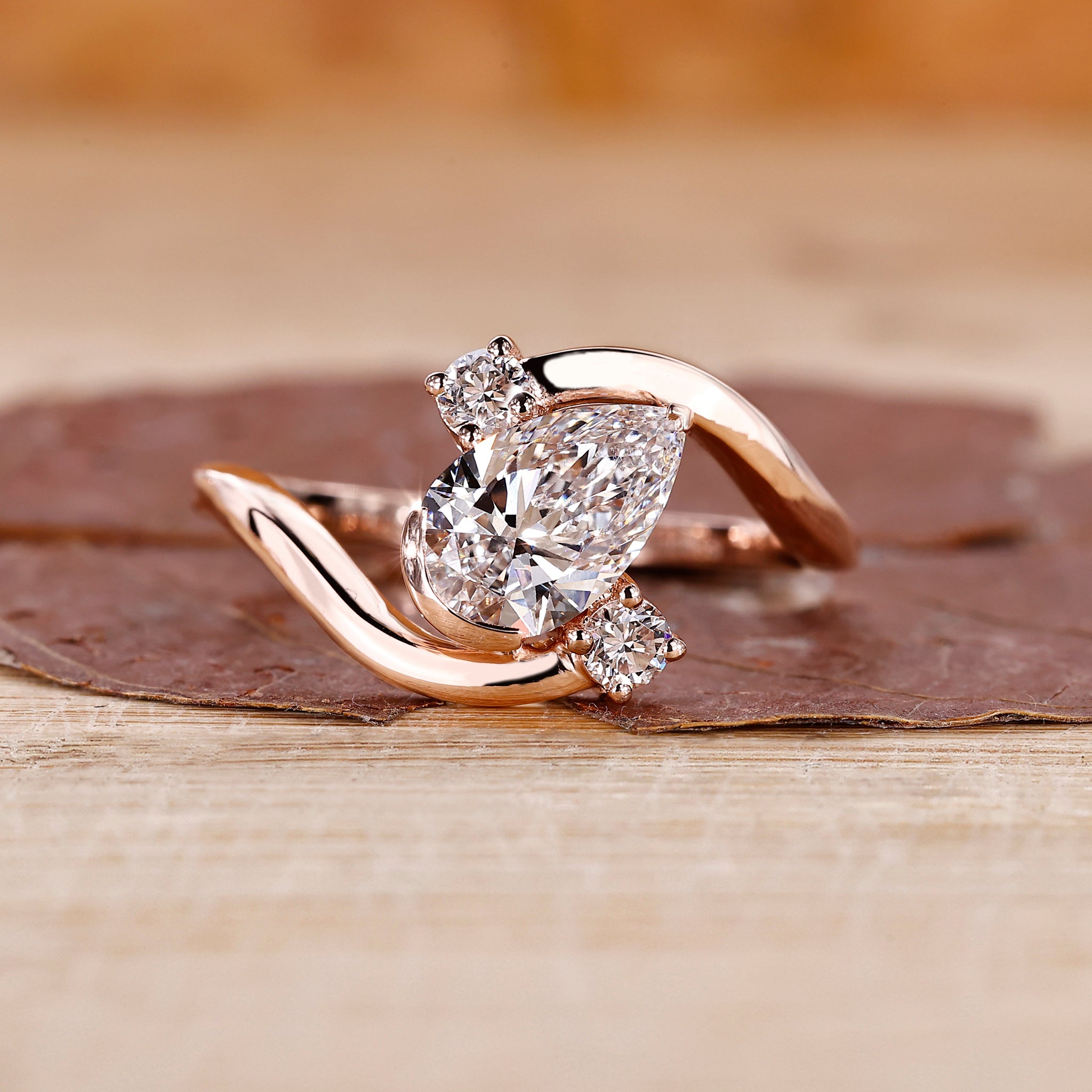Bypass setting ring with pear cut diamond center.
