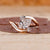 Bypass setting ring with pear cut diamond center.
