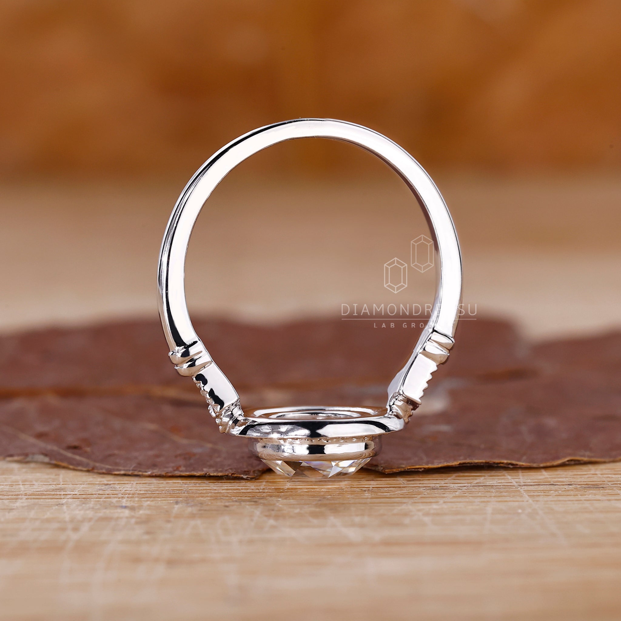 Three stone ring includes one centre and two side diamonds.