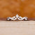 Tiara wedding band with moonstone and diamond accents.
