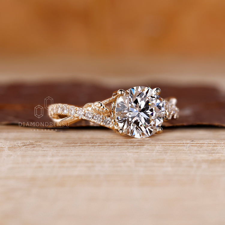 Yellow gold engagement ring featuring twisted design.
