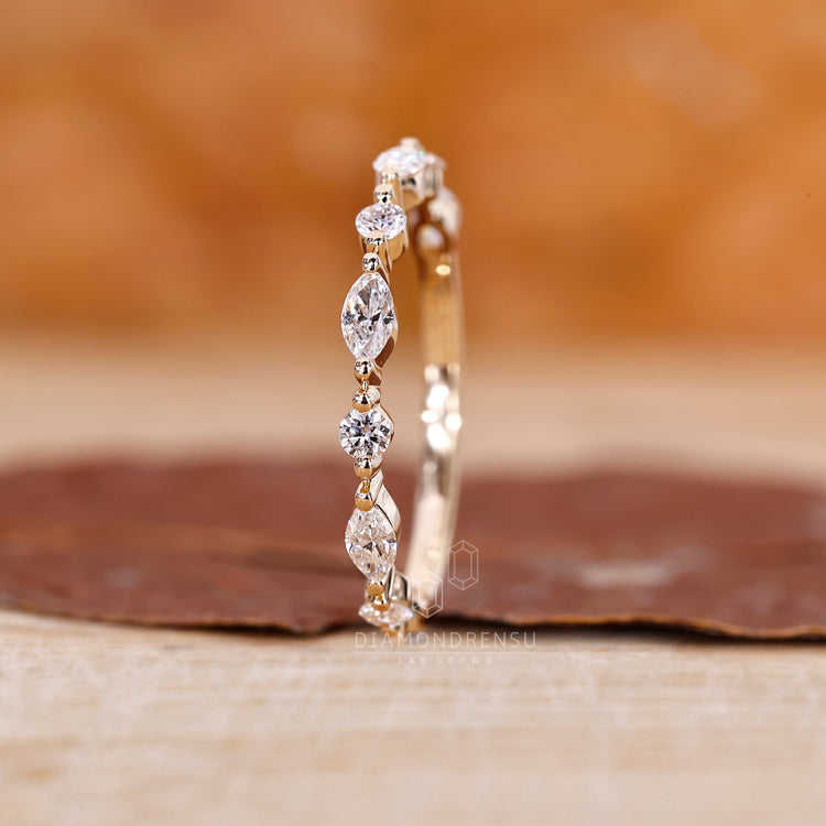 Custom diamond band featuring marquise and round diamonds.