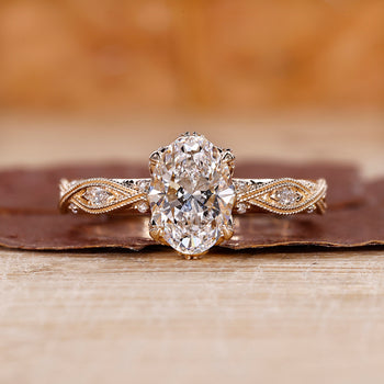 Oval cut diamond ring crafted in yellow gold ring.