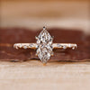 Marquise engagement ring with six claw prong setting.

