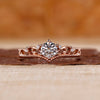 Vintage gold ring with a round diamond center.
