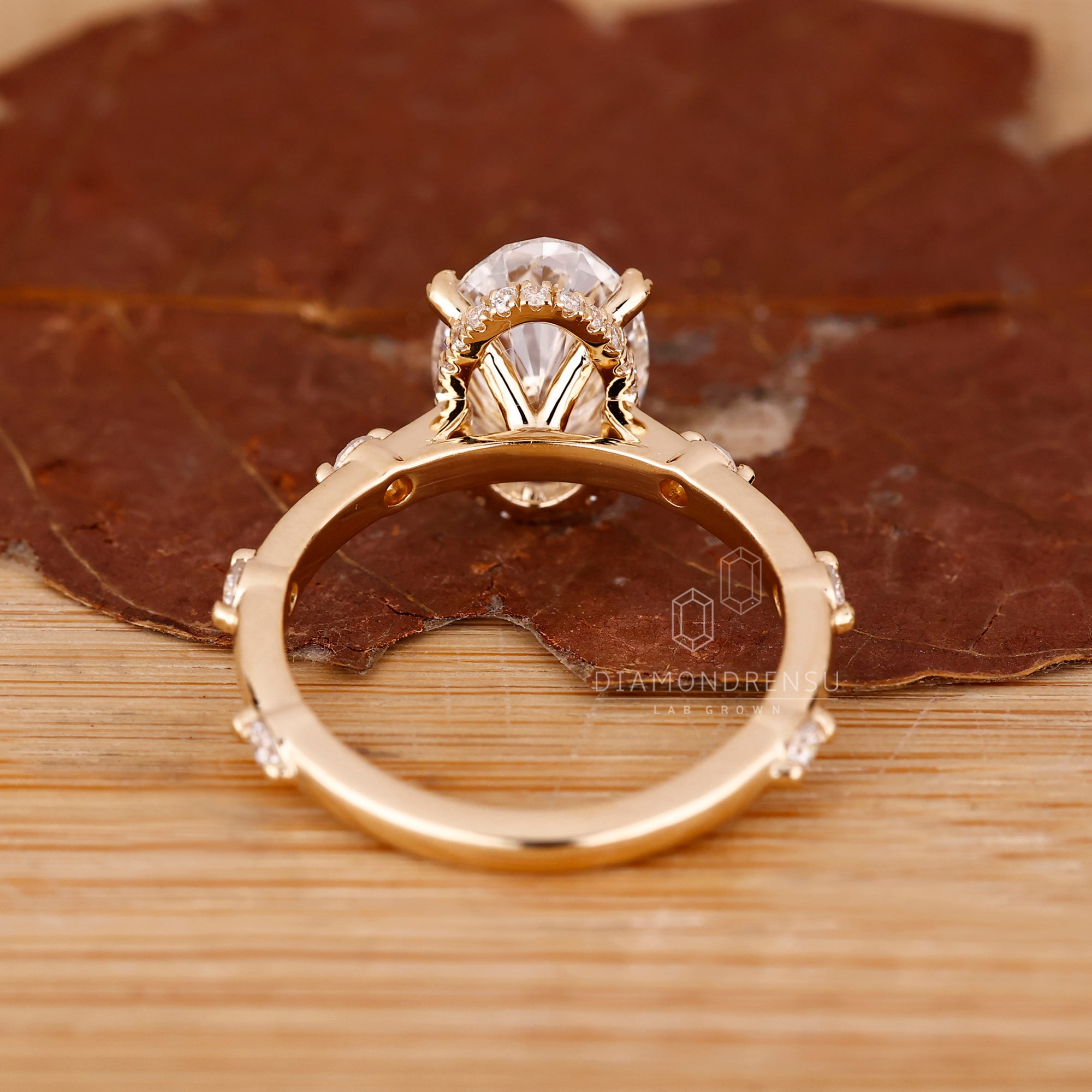 UK engagement ring with oval cut and hidden halo.
