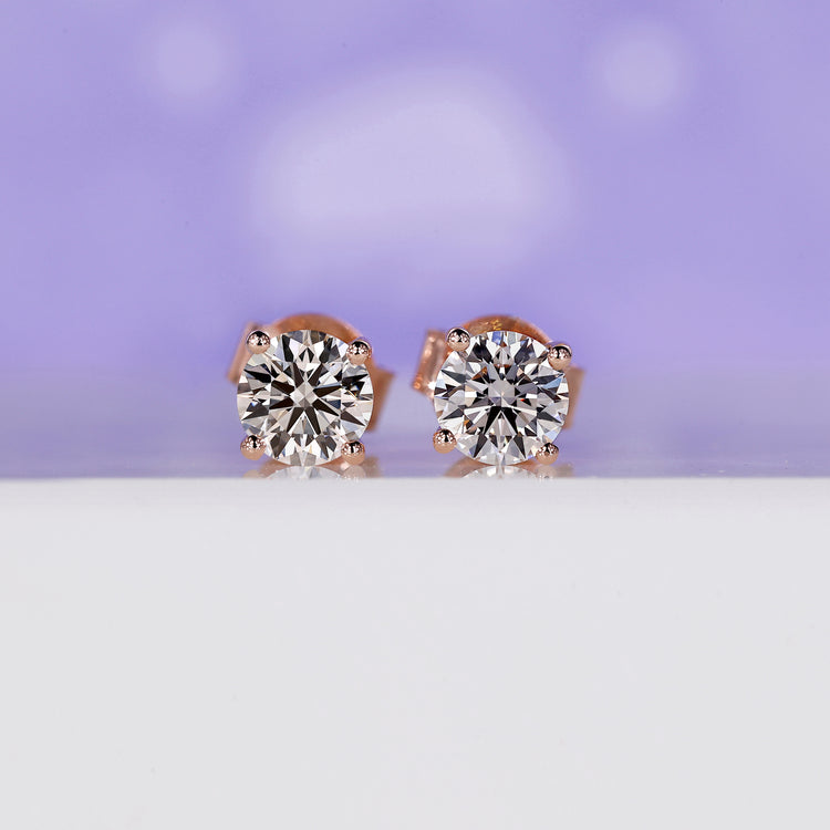 Rose gold stud earrings with round lab grown diamonds in prong setting.
