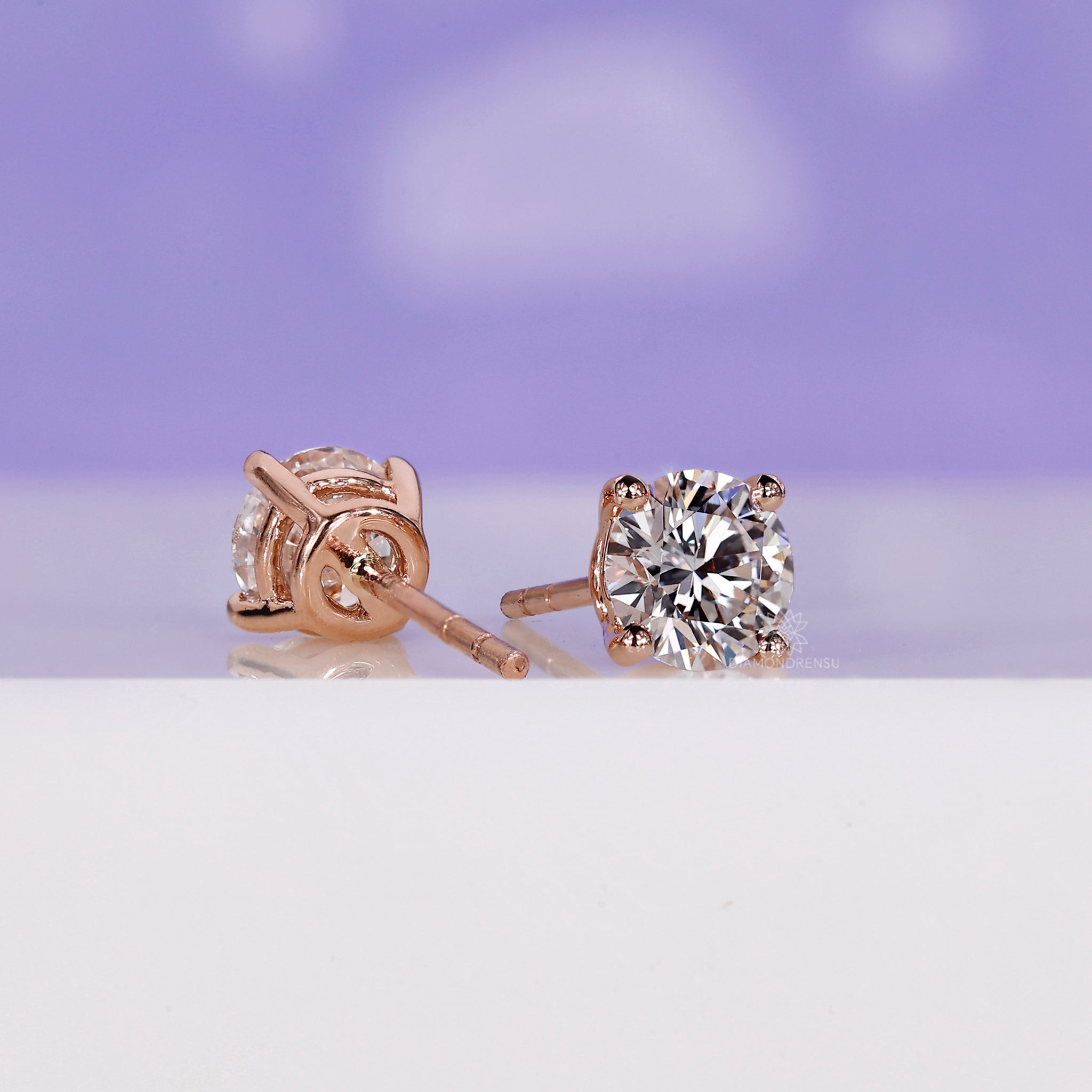 Handmade jewellery showcasing rose gold round diamond stud earrings.