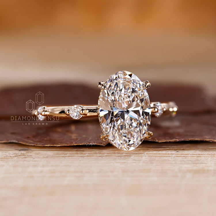 Cathedral setting ring with oval cut lab grown diamond.
