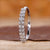 Oval diamond wedding band crafted in white gold with a sleek finish.