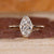 Bezel set engagement ring with a smooth modern edge.
