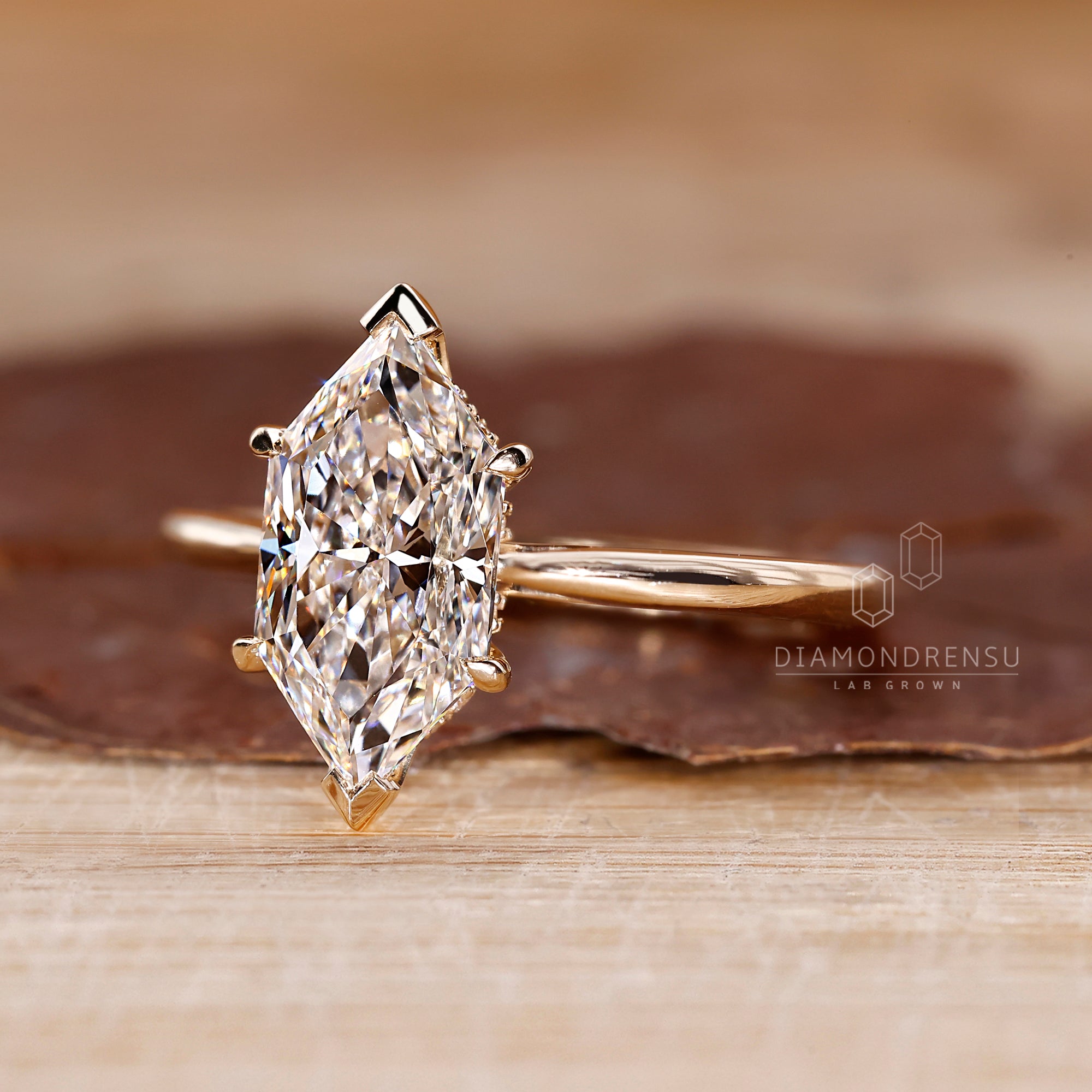 V and claw prong setting secures the center stone.
