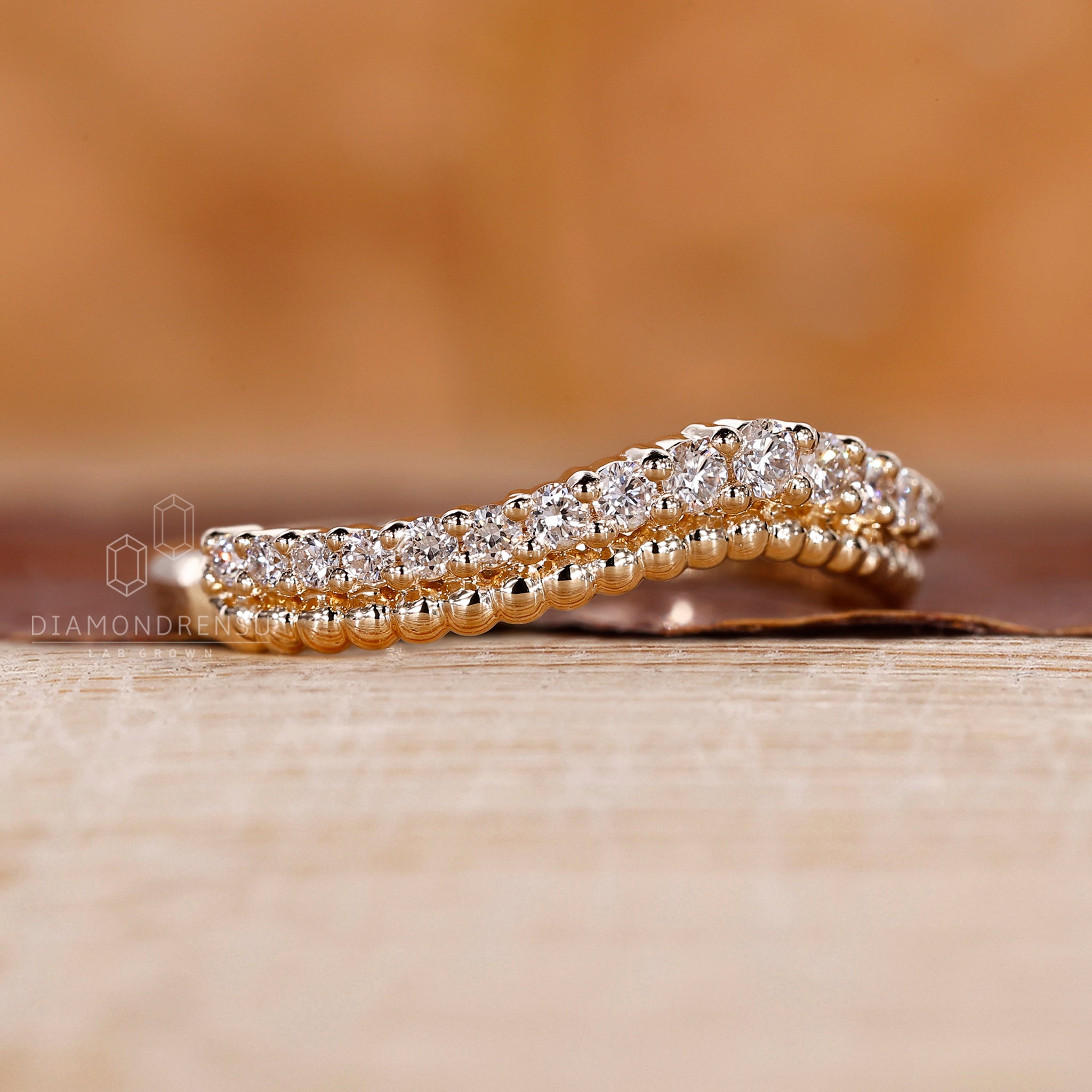 Simple wedding band designed in yellow gold with handmade finish.