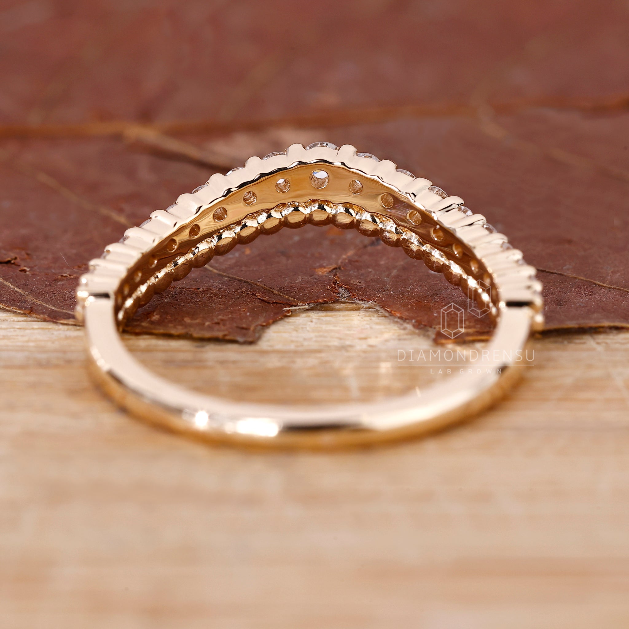 Handmade band with round diamonds and milgrain texture.